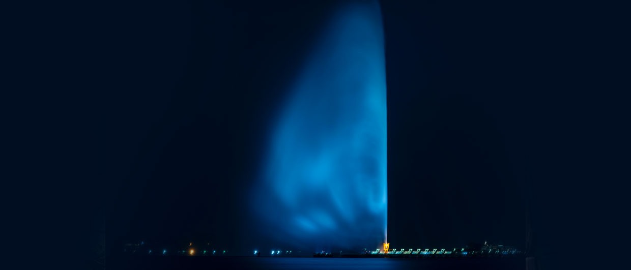 The illuminated King Fahd Fountain rising over Jeddah’s water at night