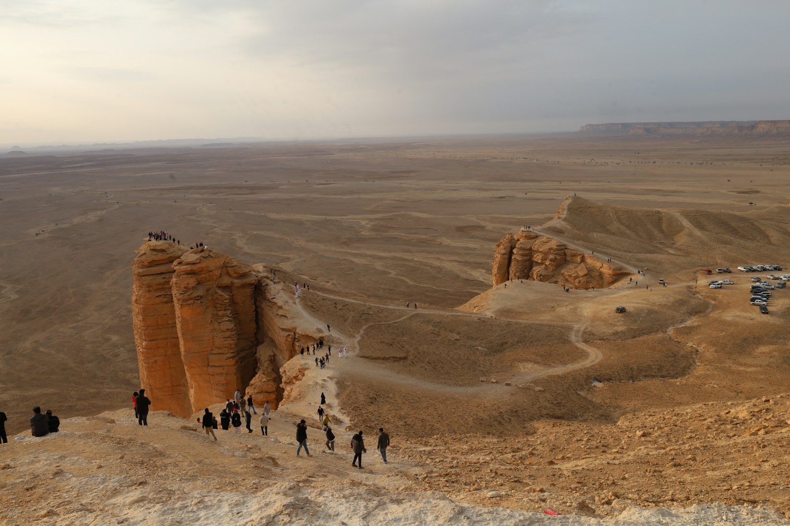 Visitors among the rocky landscapes at the Edge of the World near Riyadh